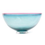 A large studio glass Venetian bowl by Bob Crooks raised on a clear crystal foot below the flared
