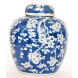 A late 19th Century Chinese blue and white Prunus Blossom ginger jar and cover,