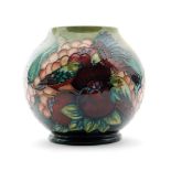 A boxed Moorcroft Pottery ovoid vase decorated in the Finches pattern designed by Sally Tuffin,