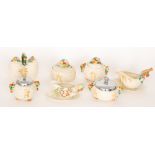 A small collection of 1930s Clarice Cliff comprising two sauce boats on stands,