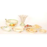 Seven pieces of 1930s Clarice Cliff comprising a salad bowl and servers, four serving dishes,