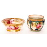A Royal Worcester footed bowl decorated with hand painted pink and crimson roses,