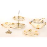 Four pieces of 1930s Clarice Cliff comprising a cake plate, a two-tier sandwich plate,