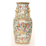 A large Chinese Canton Famille Rose baluster vase decorated with enamel and gilt scenes of women in