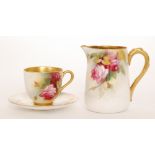 A Royal Worcester cabinet cup and saucer decorated with hand painted roses and foliage,
