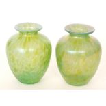 In the manner of Loetz - A pair of glass vases of shouldered form below a short flared collar neck