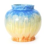 Ruskin Pottery - A crystalline glaze vase of footed ovoid form decorated in a streaked blue to