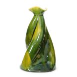 Christopher Dresser - Ault Pottery - A late 19th Century Propeller vase glazed in a tonal green,