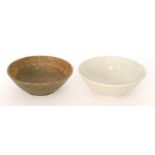 Two Ruskin Pottery high sided footed bowls, the first glazed in a pale blue and pale yellow,