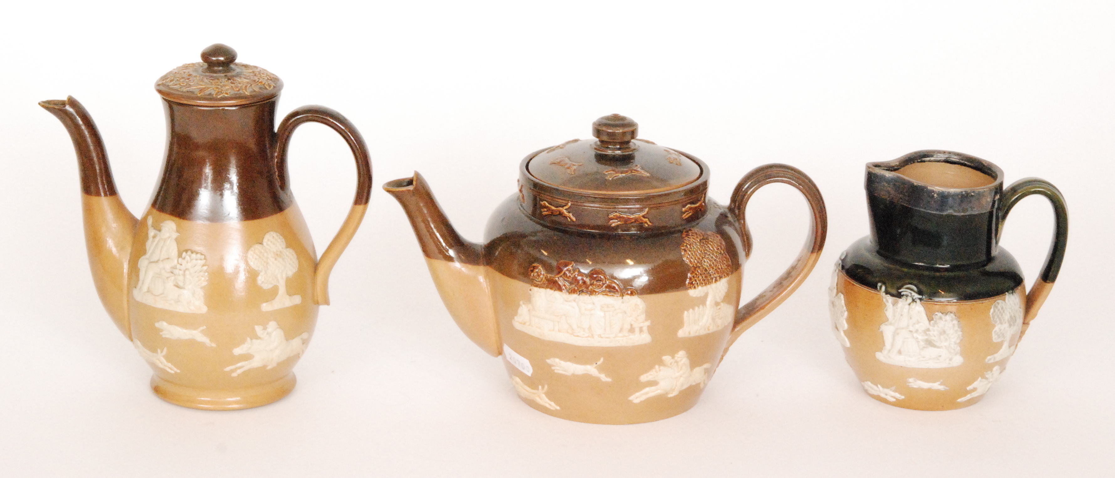 An early 20th Century Royal Doulton salt glaze teapot and coffee pot,