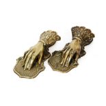 A matched pair of brass sprung hand letter clips each by J & E Ratcliff, Birmingham, length 14cm.