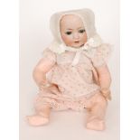 A Heubach and Kopplesdorf bisque head doll with fixed eyes and open mouth,