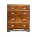 An oak chest of four graduated drawers in the Georgian style,