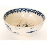 A late 18th to early 19th Century footed bowl decorated in blue and white with a hand painted