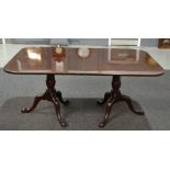 A mahogany twin pedestal dining table in the Georgian style,