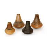 A collection of four early 20th Century African vessels of gourd form,