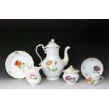 An early 20th Century Meissen Deutsche Blumen twelve place teaset comprising teapot, sucrier,