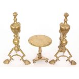 A pair of Victorian brass fire dogs and a miniature tilt top loo table (3)