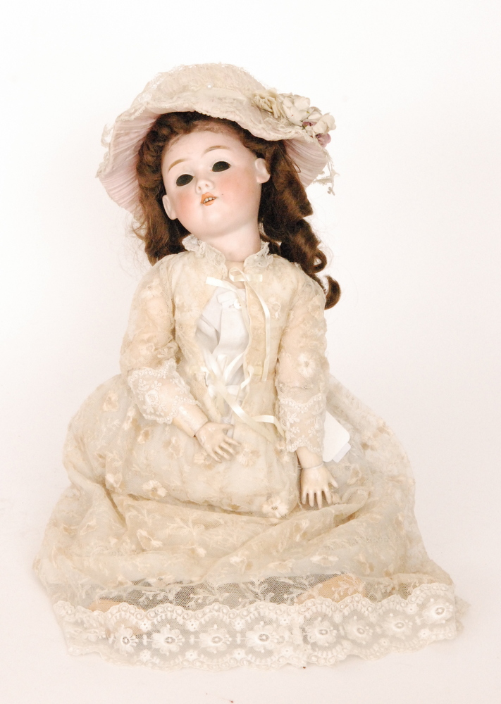 A Max Handwerck German bisque head doll with open close eyes and mouth and jointed composition body
