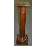 A 19th Century mahogany Doric turned pedestal on a square plinth base,