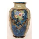 A large early 20th Century Royal Doulton vase of high shouldered form panel decorated with