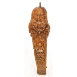 A Victorian carved oak newel post in the form of a bearded man tapering with recessed floral panels,