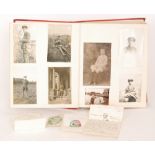 An album of late Victorian photographs together with a small collection of greetings cards,