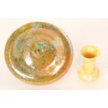 A Ruskin Pottery eggshell footed saucer dish decorated in a mottled ochre and blue glaze,