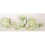 A large collection of assorted 1930s and later Carlton Ware embossed wares all in green with floral