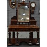 A Victorian mahogany kneehole dressing table, fitted with an arrangement of seven drawers,