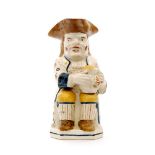 A late 18th Century Pratt Ware type Ordinary Toby jug,