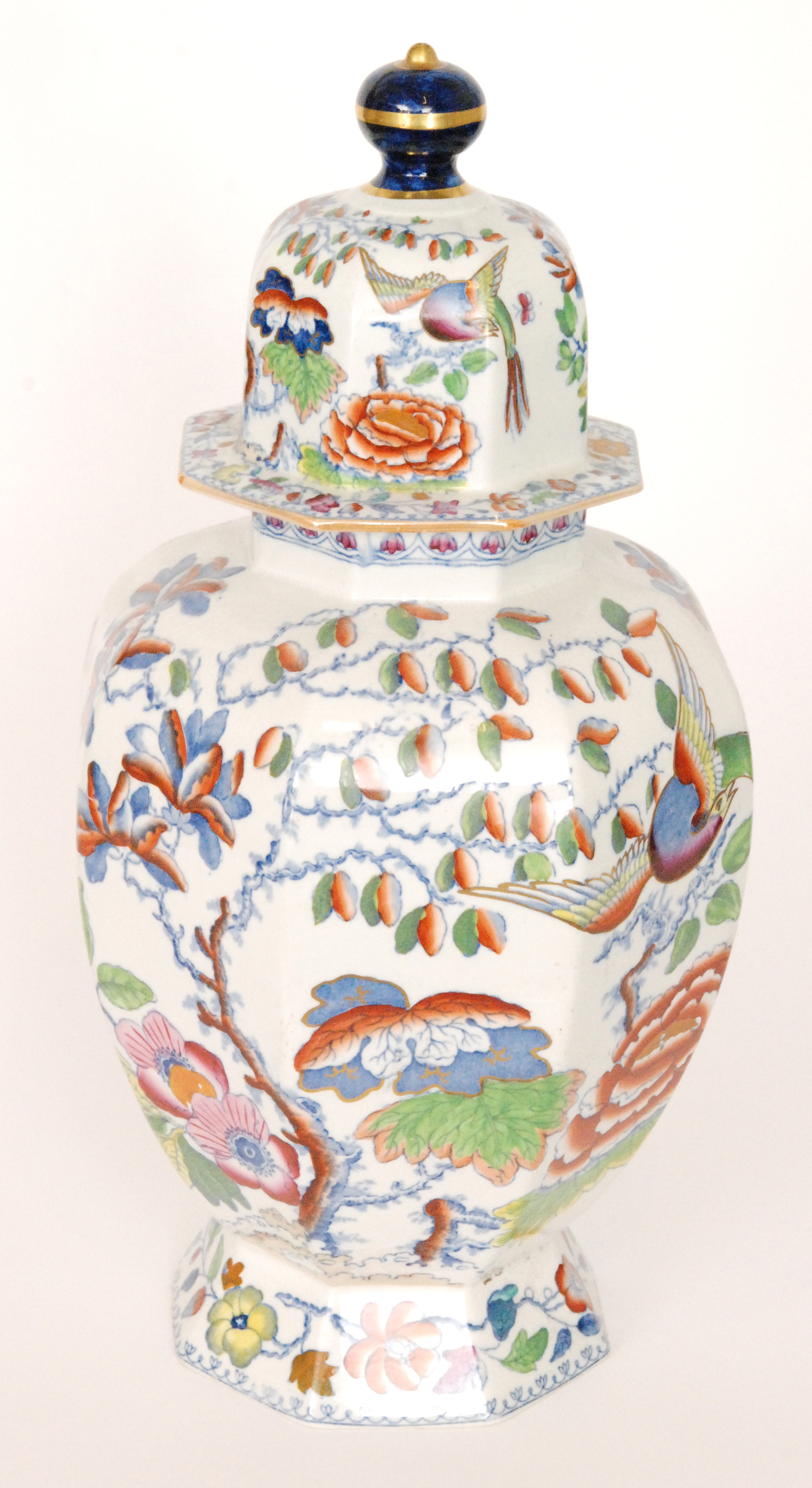 A large early 20th Century Masons Ironstone hexagonal vase and cover decorated with birds amidst