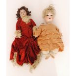 An SFBJ bisque head doll, jointed composition body wearing a red velvet dress,