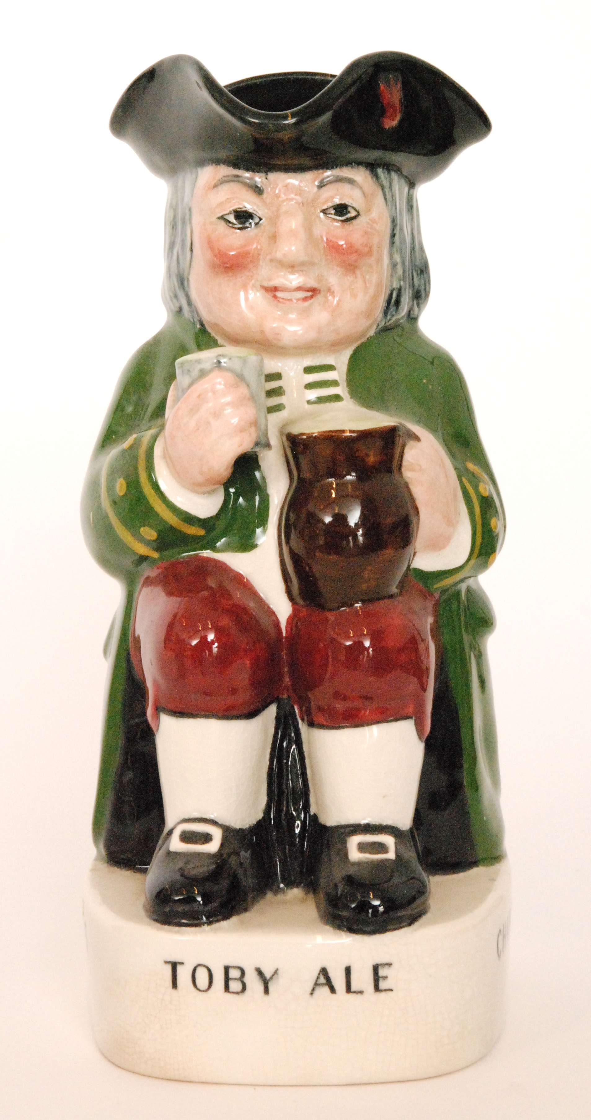 A 1930s advertising / promotional Ordinary Toby jug detailed to the pedestal Charrington's Toby Ale,