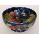 A Moorcroft Clematis pattern high sided footed bowl decorated to the interior and exterior with
