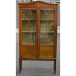 An early 20th Century mahogany glazed double door cabinet,