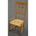 A late 19th Century oak, ash and beech rocking chair,