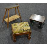 A small occasional table on glass legs,