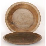 An early 19th Century circular elm bowl with raised line dished rim, diameter 56cm,
