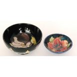 A small Moorcroft footed bowl decorated in the Hibiscus pattern with a central tubelined flower