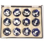 A boxed set of twelve later 20th Century Baccarat Zodiac glass paperweights each decorated with a