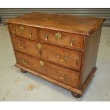 An 18th Century crossbanded walnut chest of two short and two long drawers,
