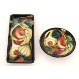 Two pieces of Moorcroft Pottery decorated in the Queens Choice pattern designed by Emma Bossons