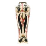A large Moorcroft Pottery vase of tapering form decorated in The Gardeners pattern designed by