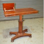 A Victorian mahogany invalids table with double ratchet adjustable end on a pedestal and quatrefoil