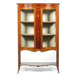 An early 20th Century Sheraton Revival serpentine-fronted mahogany salon side cabinet,