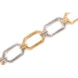 A 1960s to 1970s 18ct white and yellow gold link bracelet designed with six flexible hexagonal