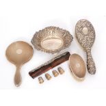 A small parcel lot of hallmarked silver items to include an oval C scroll embossed pin dish,
