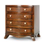 A 19th Century crossbanded mahogany bow front four drawer apprentice chest on splayed legs,