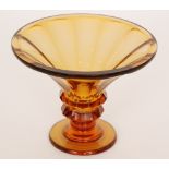 A 1930s glass pedestal bowl in the manner of Moser, of faceted flared form all to an amber ground,